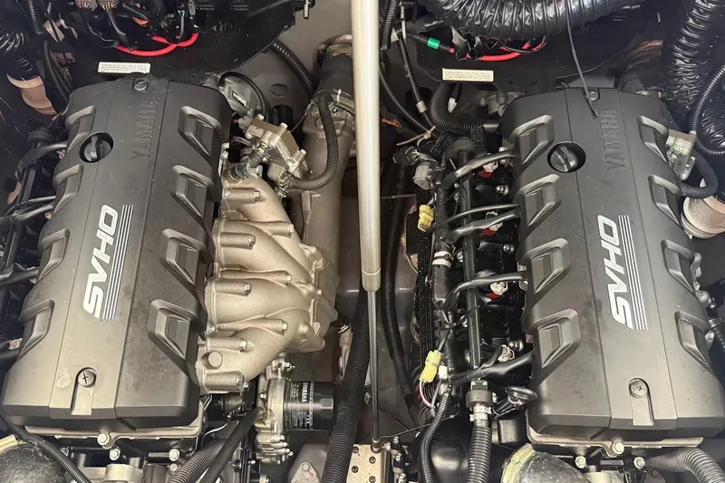 Slide: The Image of 2024 Yamaha Boats 255 FSH Sport H engine compartment with dual SVHO engines. - 27