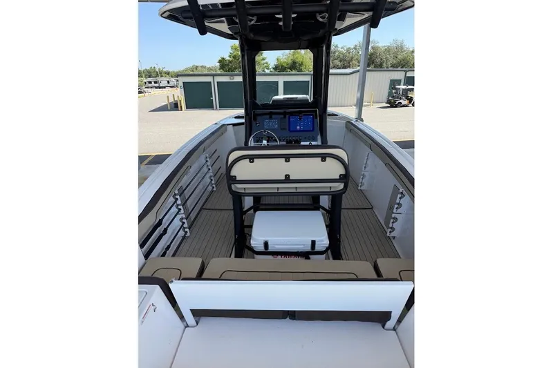 Slide: The Image of 2024 Yamaha Boats 255 FSH Sport H interior with helm and seating area. - 17