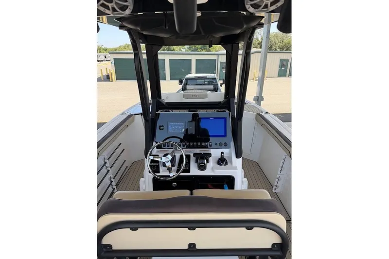 Slide: The Image of 2024 Yamaha Boats 255 FSH Sport H helm with modern controls and navigation display. - 18