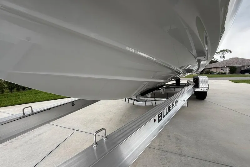 Slide: The Image of 2025 Yamaha Boats AR250 on Bluefin trailer, showcasing sleek hull design. - 26