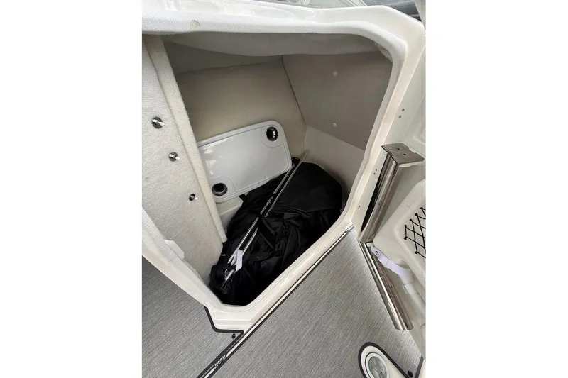 Slide: The Image of 2025 Yamaha AR250 boat storage compartment with interior view and equipment. - 18
