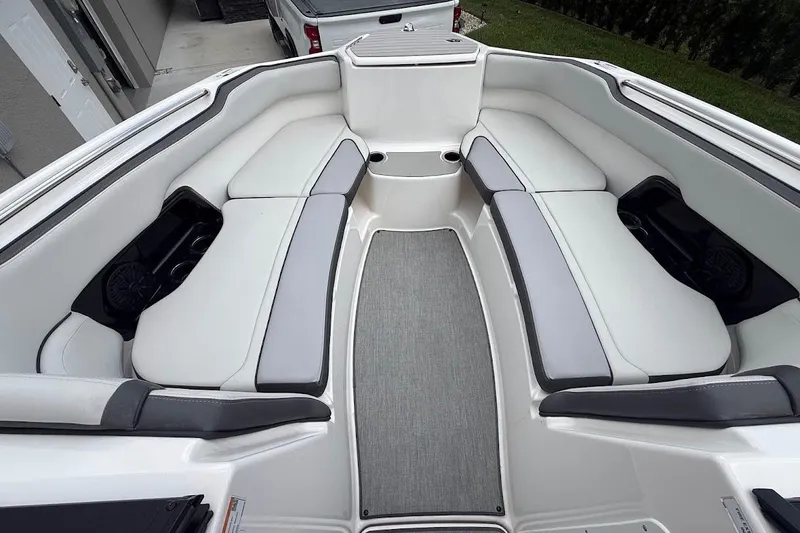 Slide: The Image of 2025 Yamaha Boats AR250 interior with spacious seating and modern design. - 10