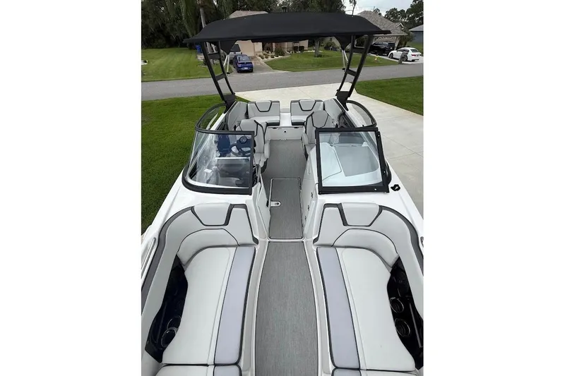 Slide: The Image of 2025 Yamaha Boats AR250 interior with sleek seating and modern design. - 11