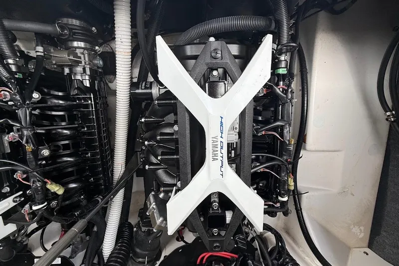 Slide: The Image of Engine compartment of a 2025 Yamaha Boats AR250, showcasing high-output components. - 16