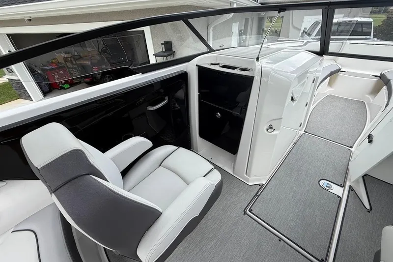 Slide: The Image of 2025 Yamaha Boats AR250 interior with sleek seating and modern design. - 9