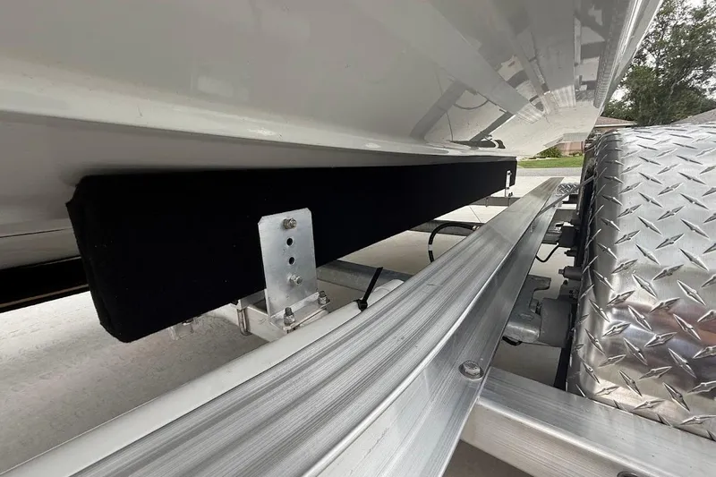 Slide: The Image of 2025 Yamaha Boats AR250 trailer detail with metal and padded components. - 25