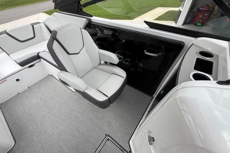 Slide: The Image of 2025 Yamaha Boats AR250 interior with sleek seating and modern design features. - 13