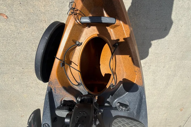 Slide: The Image of Top view of 2023 OldTown Sportsman PDL 106 kayak on concrete surface. - 12
