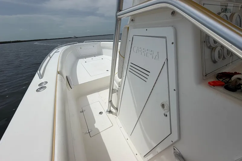 Slide: The Image of 2004 Carrera Boats 27 CC Open, white interior, on calm water. - 20