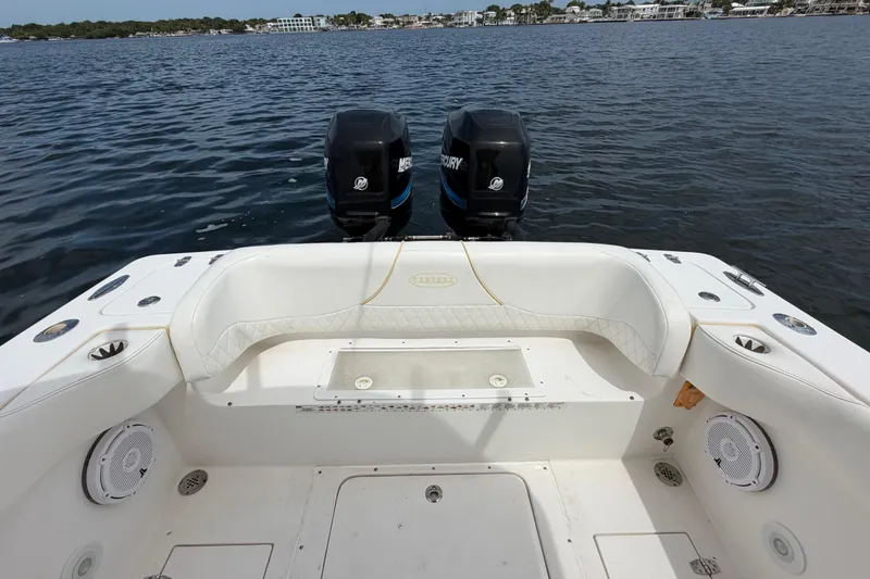 Slide: The Image of 2004 Carrera Boats 27 CC Open with dual Mercury engines on calm water. - 30