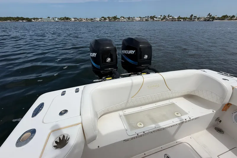 Slide: The Image of 2004 Carrera Boats 27 CC Open with dual Mercury engines on calm water. - 31