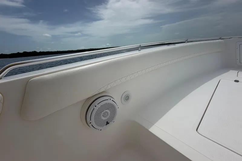 Slide: The Image of 2004 Carrera Boats 27 CC Open interior with speaker, railing, and ocean view. - 14