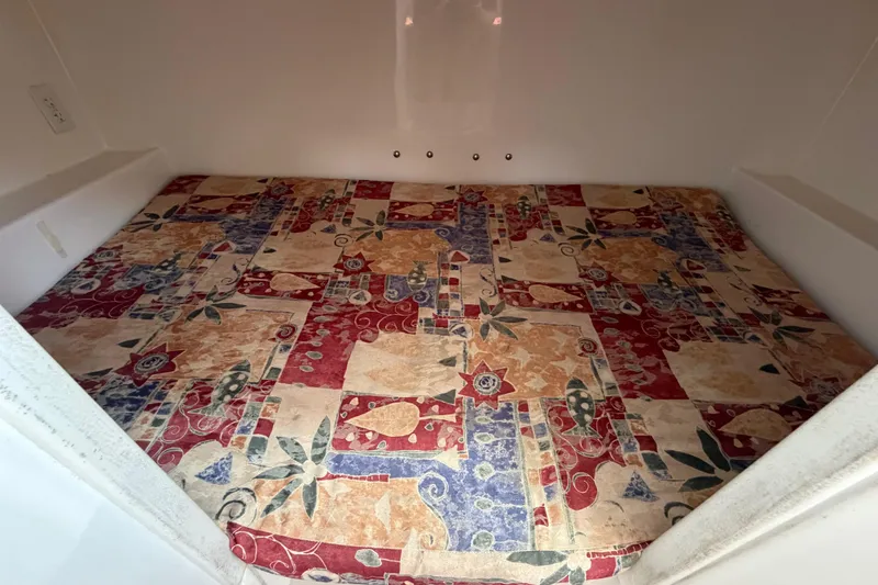 Slide: The Image of Interior cabin of 2001 Stamas 270 Express with colorful patterned bedding. - 44