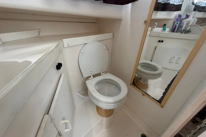 Slide: The Image of Bathroom interior of 2001 Stamas 270 Express boat with toilet and mirror. - 42