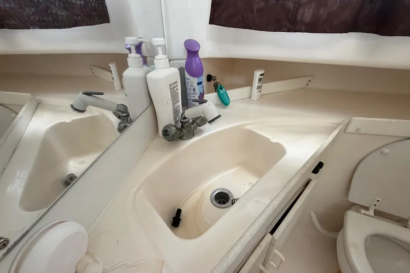 Slide: The Image of Boat bathroom sink and toiletries in a 2001 Stamas 270 Express. - 43