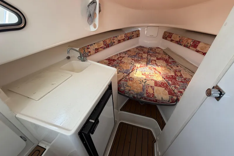 Slide: The Image of 2001 Stamas 270 Express cabin interior with sink, patterned cushions, and compact layout. - 37