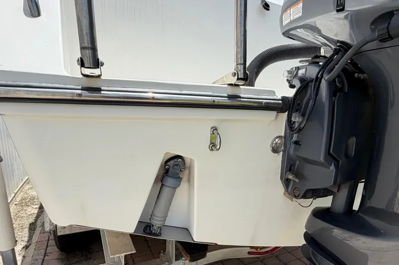 Slide: The Image of 2001 Stamas 270 Express boat stern with outboard motor and stainless steel fittings. - 13