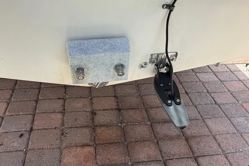 Slide: The Image of Rear view of a 2001 Stamas 270 Express boat on a brick surface. - 12