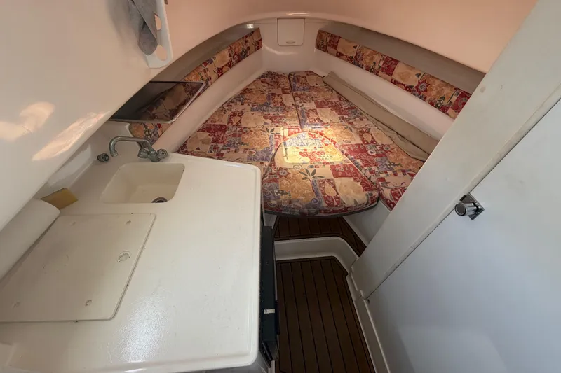 Slide: The Image of Interior of 2001 Stamas 270 Express boat with cozy cabin and compact sink area. - 36