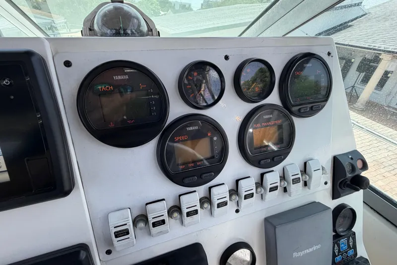 Slide: The Image of Dashboard of a 2001 Stamas 270 Express boat with Yamaha gauges and controls. - 28