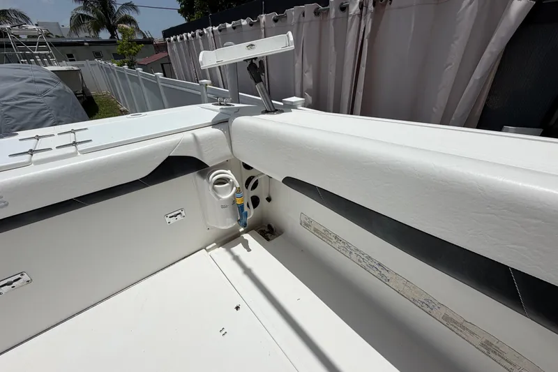 Slide: The Image of 2001 Stamas 270 Express boat interior with white seating and storage compartments. - 17