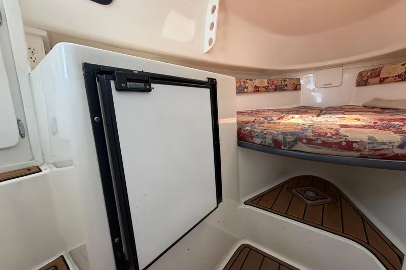 Slide: The Image of Interior of 2001 Stamas 270 Express boat with compact fridge and cozy sleeping area. - 39