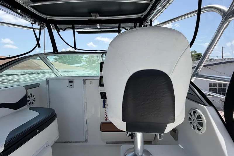 Slide: The Image of Interior view of 2001 Stamas 270 Express boat cockpit with seating and controls. - 31