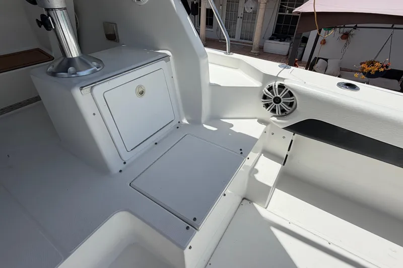 Slide: The Image of 2001 Stamas 270 Express boat interior with storage compartment and speaker. - 20