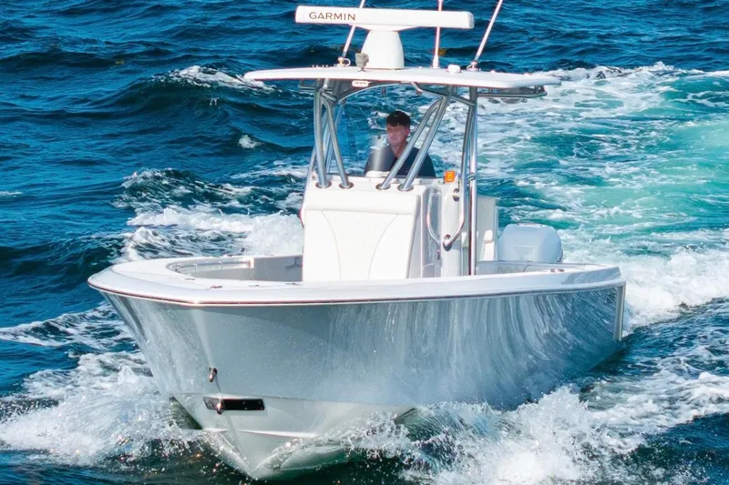 Slide: The Image of 2022 Contender 32 ST boat navigating through ocean waves. - 11