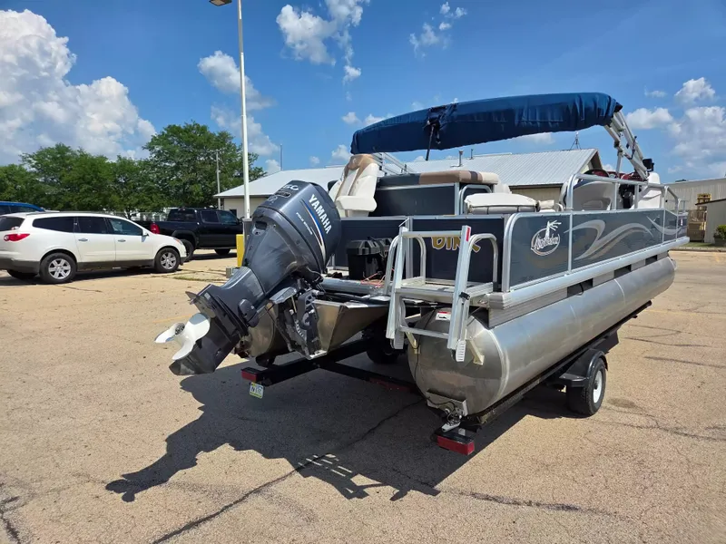 Slide: The Image of A 2010 Misty Harbor 2085 CF pontoon boat with a Yamaha outboard motor on a trailer. - 7
