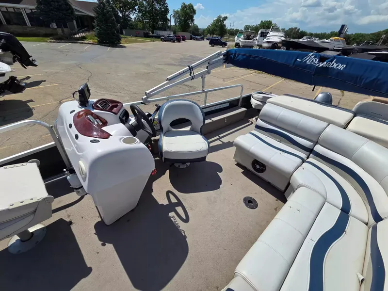 Slide: The Image of The image shows the cockpit of a 2010 Misty Harbor 2085 CF with white seats and blue accents. - 10