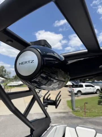 Slide: The Image of Close-up of a speaker on a Yamaha 252XE boat, with blue sky in the background. - 10