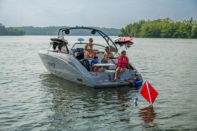 Slide: The Image of A 2026 Yamaha 252XE on a calm lake with several people on board. - 17