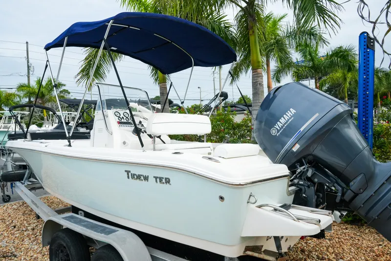 Slide: The Image of 2011 Tidewater 196 CC Adventure boat with Yamaha engine, parked on a trailer. - 8