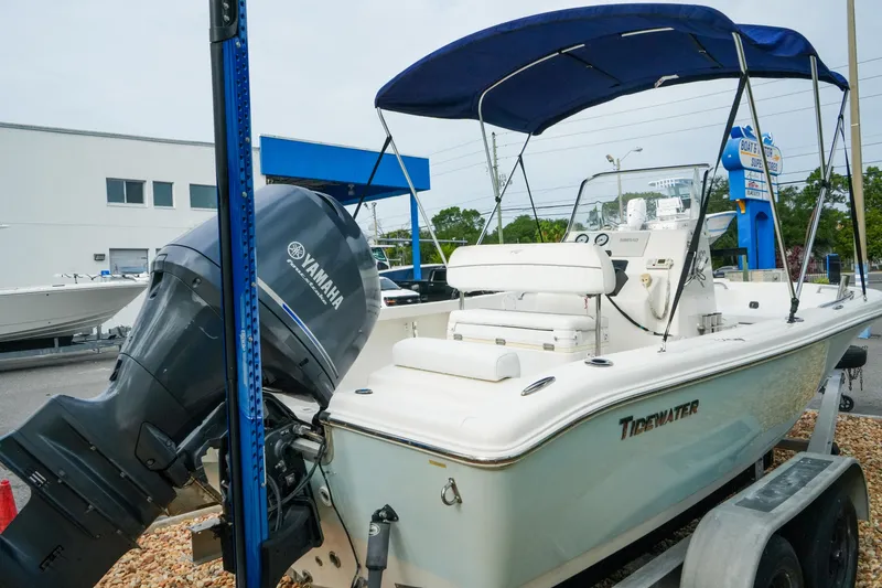 Slide: The Image of 2011 Tidewater 196 CC Adventure boat with Yamaha outboard motor, parked on a trailer. - 6
