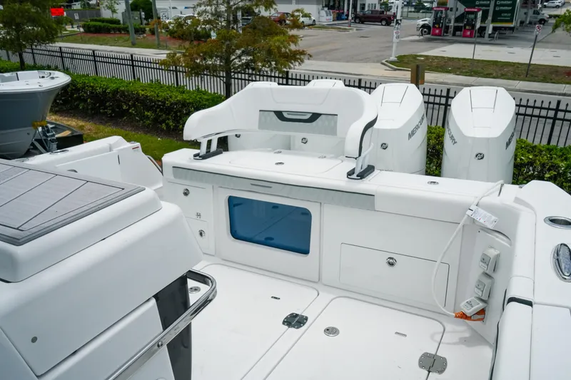 Slide: The Image of 2025 Blackfin 400 CC boat deck with Mercury engines and storage compartments. - 27