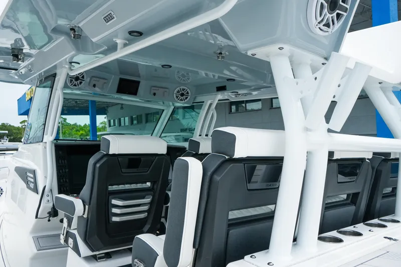 Slide: The Image of 2025 Blackfin 400 CC boat interior with modern seating and advanced controls. - 14
