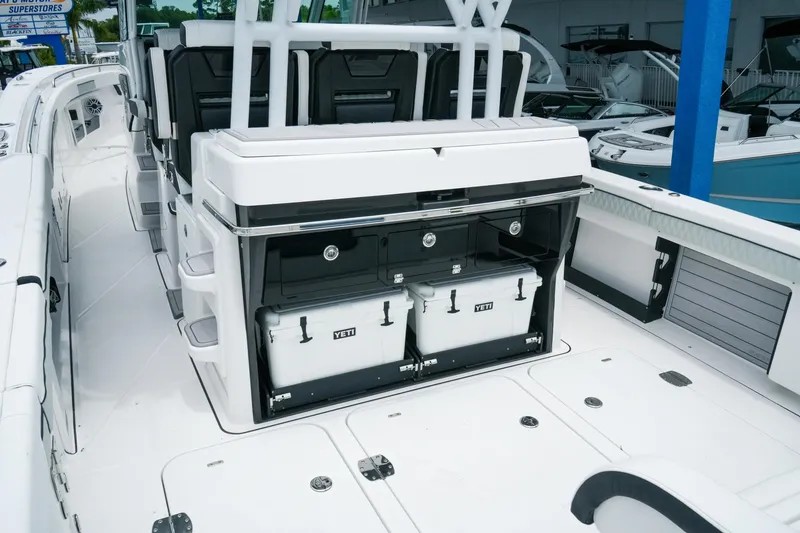 Slide: The Image of 2025 Blackfin 400 CC boat interior with storage and YETI coolers. - 8