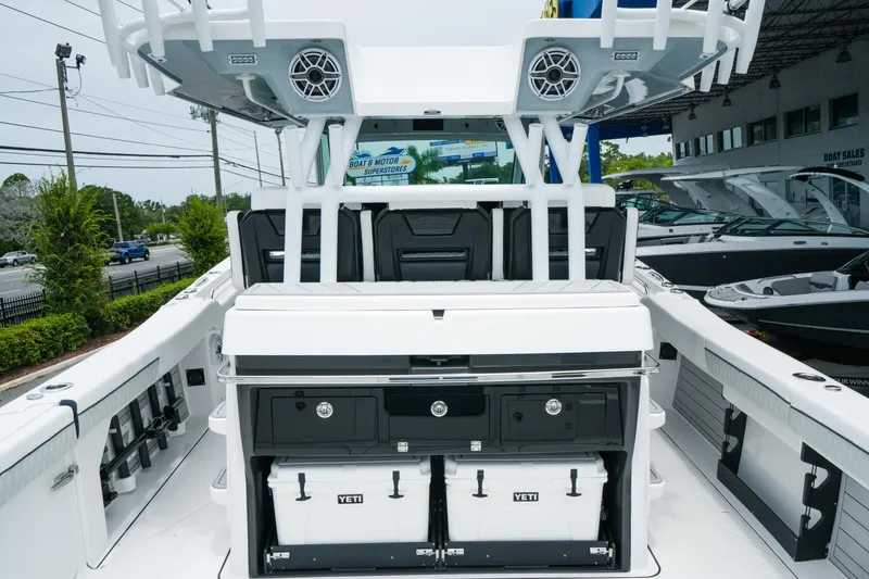 Slide: The Image of 2025 Blackfin 400 CC boat interior with storage and Yeti coolers. - 9