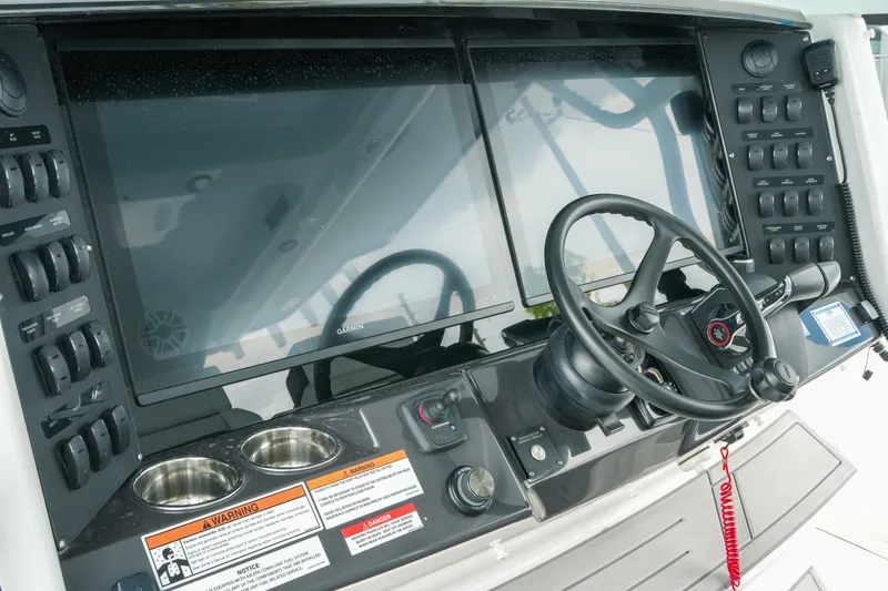 Slide: The Image of 2025 Blackfin 400 CC boat dashboard with steering wheel and control panel. - 17