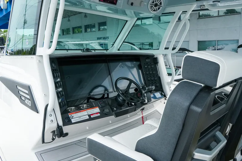 Slide: The Image of Interior view of 2025 Blackfin 400 CC boat cockpit with modern controls and seating. - 15