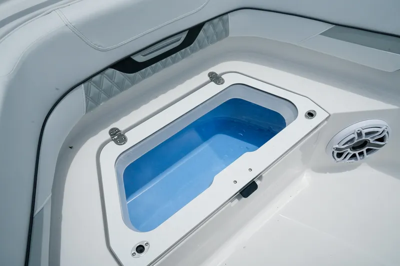 Slide: The Image of Livewell on 2025 Blackfin 400 CC boat, featuring sleek white interior design. - 21