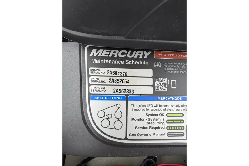 Slide: The Image of Mercury maintenance schedule label on 2018 Crownline 285 SS boat, showing serial numbers and belt routing. - 14