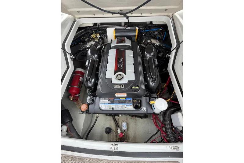 Slide: The Image of Engine compartment of a 2018 Crownline 285 SS boat, featuring a 6.2L 350 HP engine. - 13