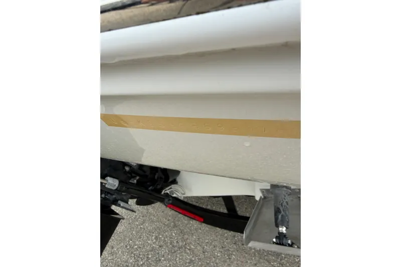 Slide: The Image of 2018 Crownline 285 SS boat hull detail with visible identification number. - 24