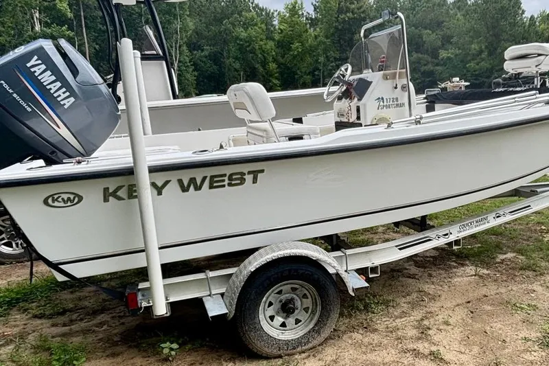 Slide: The Image of 2011 Key West 1720 Center Console boat on trailer with Yamaha engine. - 2