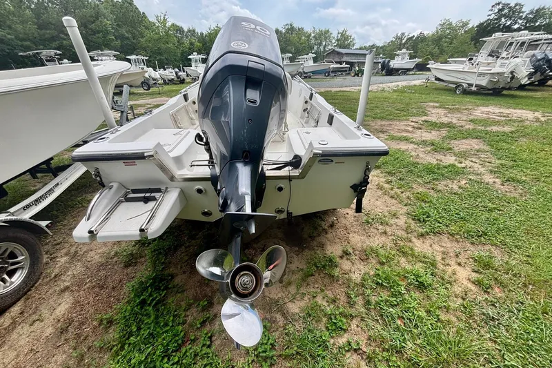 Slide: The Image of 2011 Key West 1720 Center Console boat with outboard motor on grassy lot. - 4