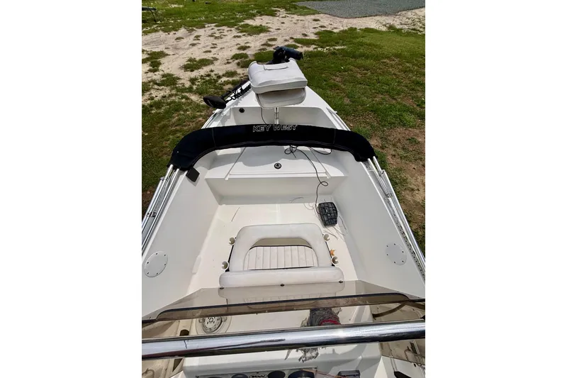 Slide: The Image of 2011 Key West 1720 Center Console boat interior with seating and console view. - 10