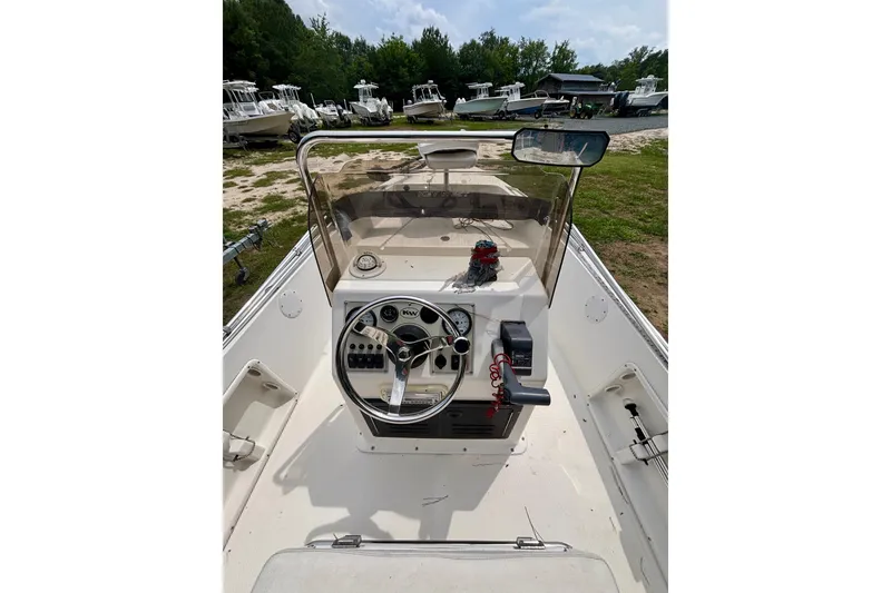 Slide: The Image of 2011 Key West 1720 Center Console boat interior with steering wheel and controls. - 9