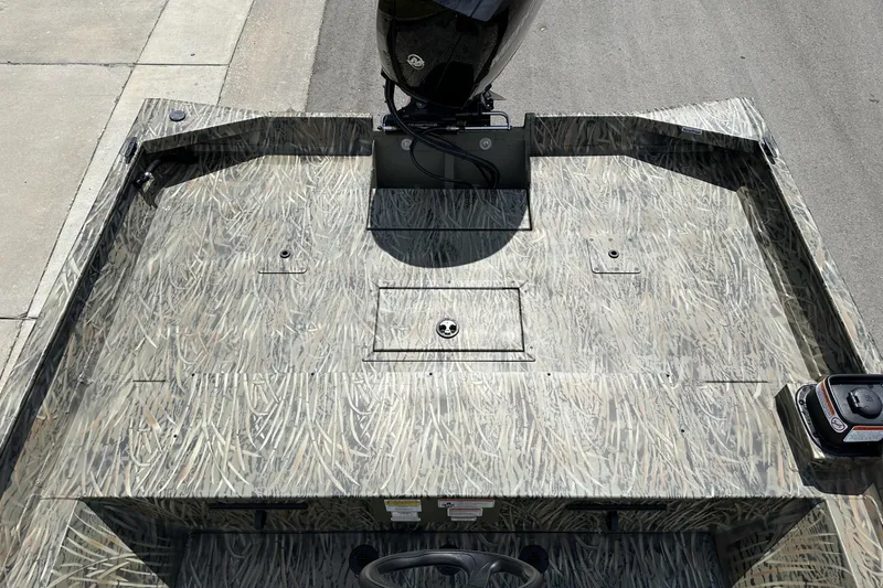 Slide: The Image of 2026 Tracker Grizzly 2072 CC boat with camo pattern deck, viewed from above. - 19